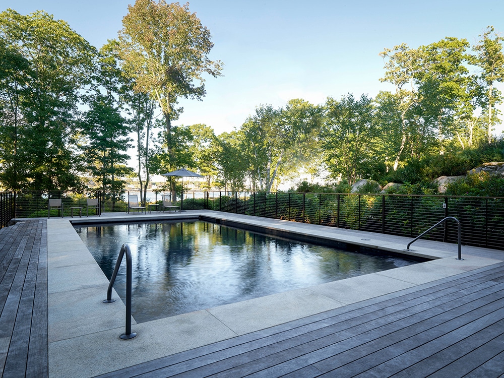JMMDS-landscape-architecture-maine-coast-gunite-pool-wood-deck-granite-coping-steel-wire-railing